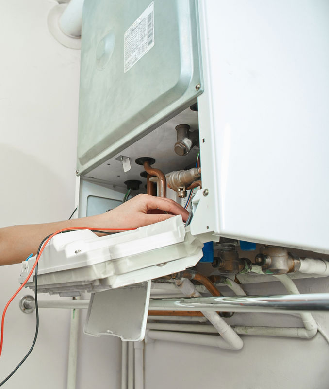 Engineer diagnosing a boiler breakdown